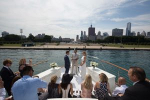 A beautiful couple exchanges vows in front of Buckingham Fountain with an intimate group| Adelines Sea Moose