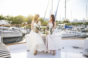 Bride and Maid of Honor pose for fabulous photo on the sundeck| Adelines Sea Moose